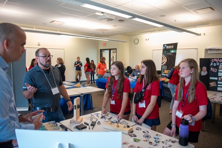 The program trains middle and high school students in STEM. Then, the kids go back to their home schools and tell others what they've learned. 