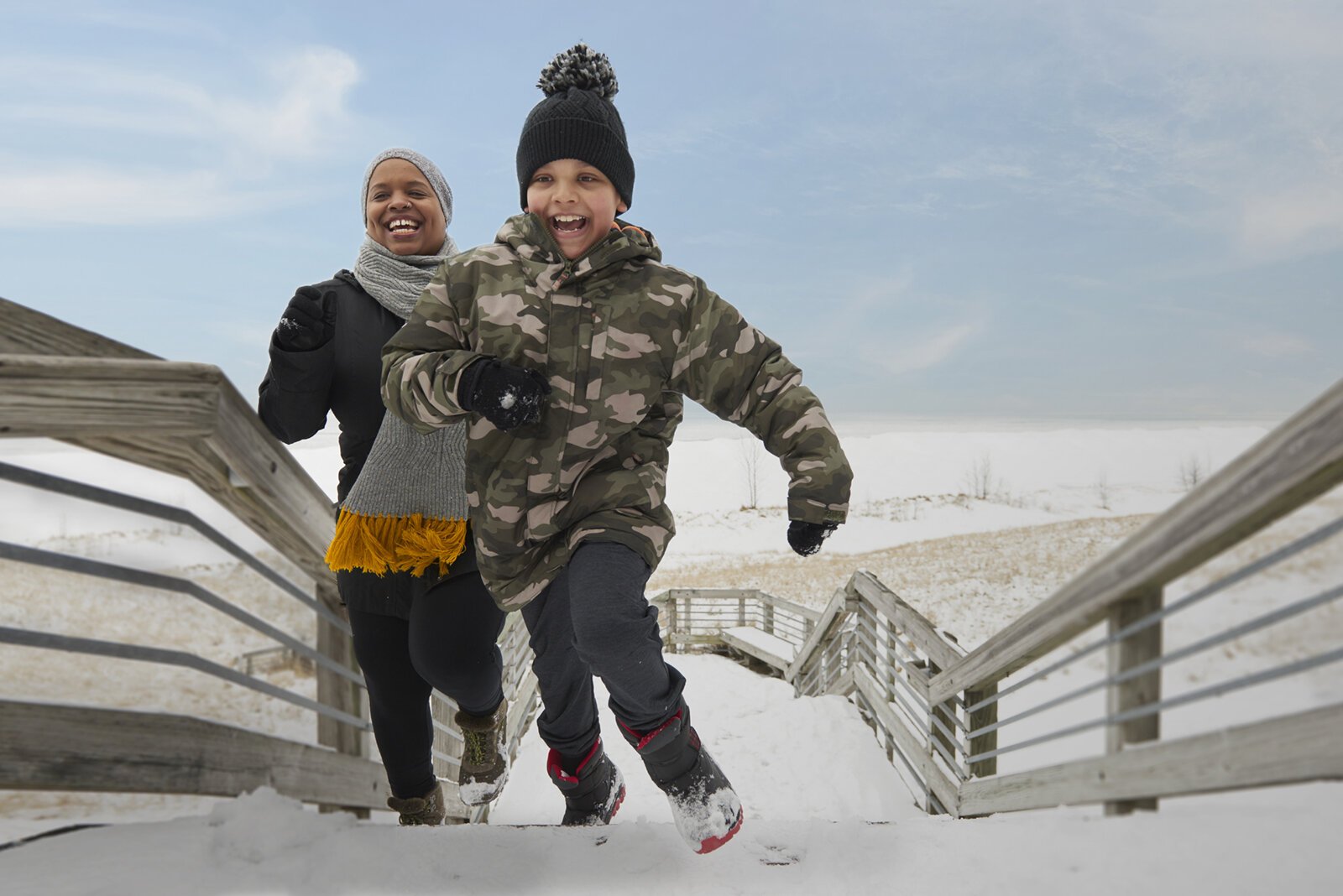People climb the stairs at Kruse Park in Muskegon.