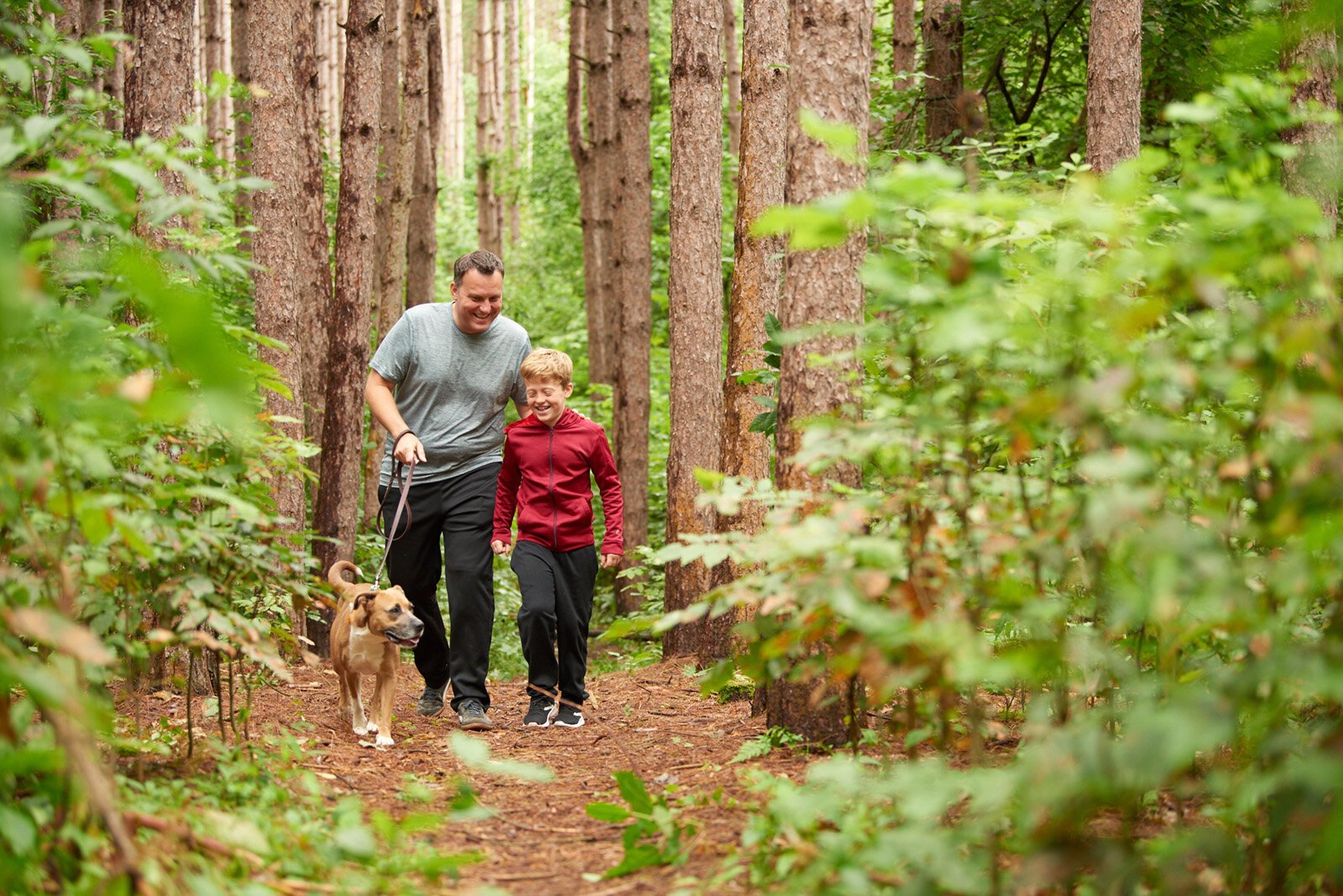 People walk at Ed Henning County Park in Newaygo.