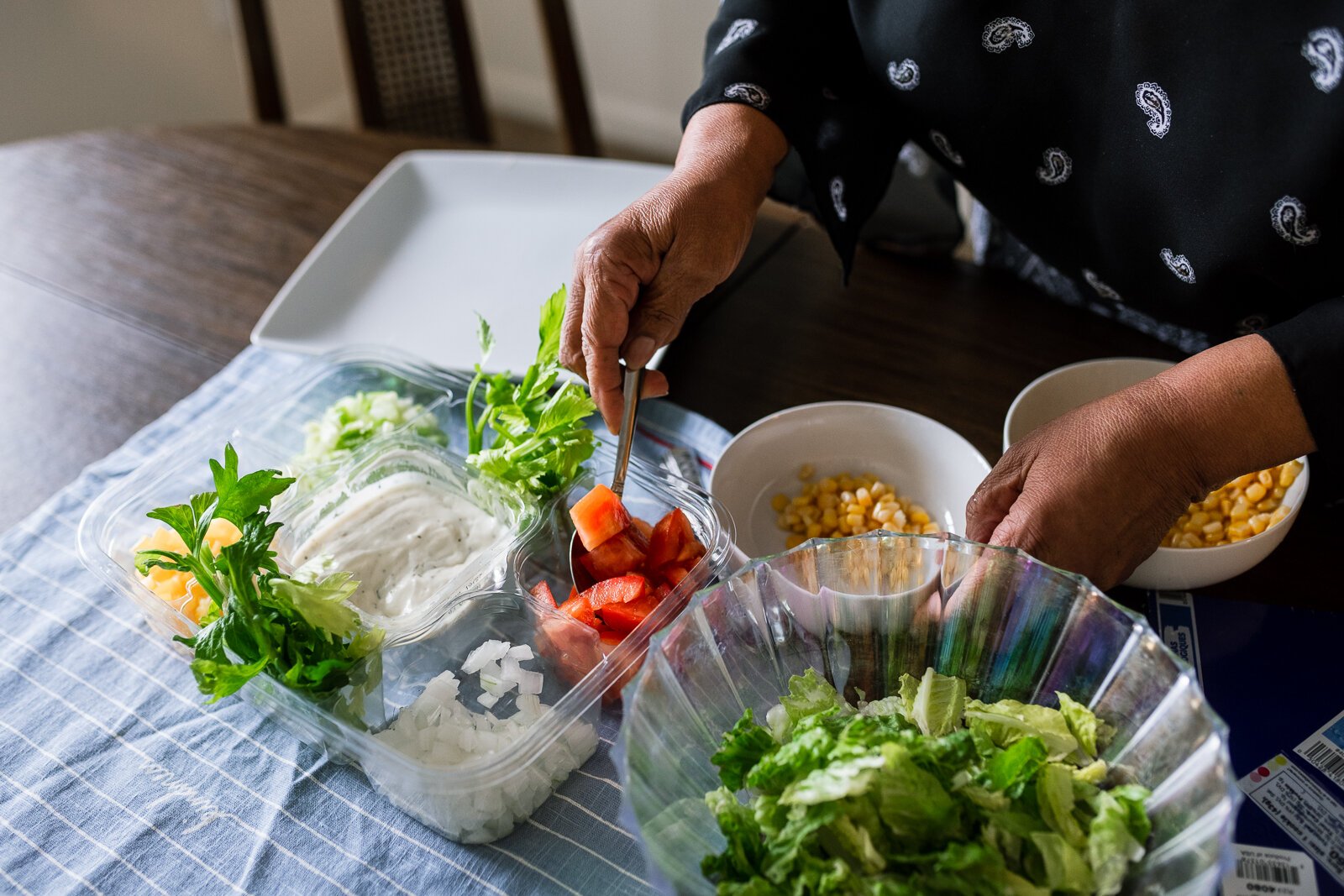 Fresh Conversations participant LaDonna Johnson makes corn salad using a recipe she got from the program.
