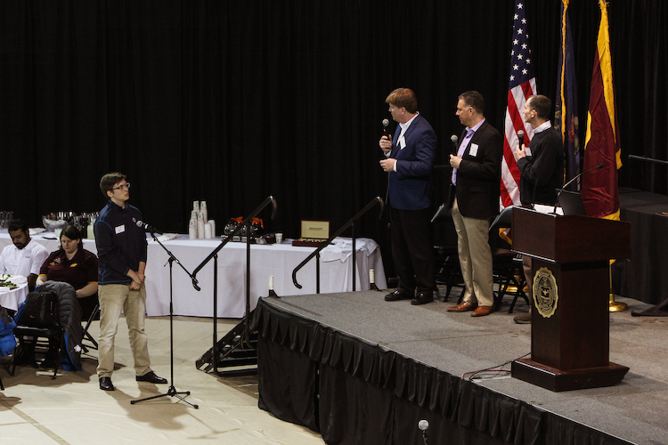Keynote speakers Scott King, Ford Motor Company, Jeffrey Anderson, SAP, and John Wassick, The Dow Chemical Company answer student questions prior to the beginning of competition. 