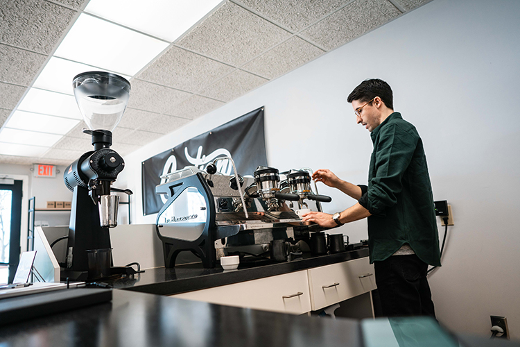 Creation Coffee co-owner Ben Marsh making an espresso.