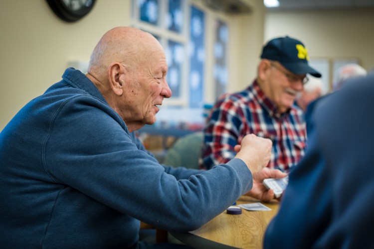 Seniors play poker at Sanford Activity and Dining Center in Midland.
