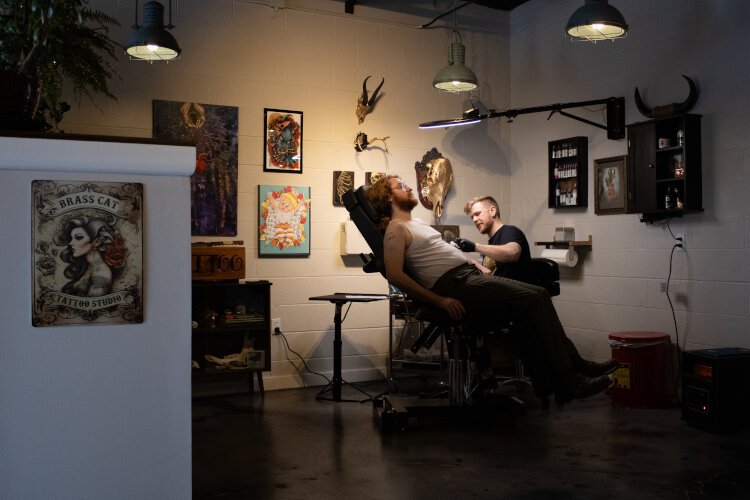 Grayson Klosowski getting a tattoo at Brass Cat Tattoo Studio