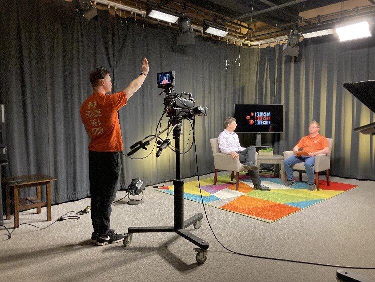 Adam White cues the host, Luke Drumright