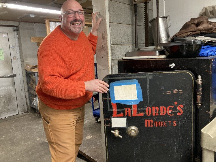 Scott posing with the market's original safe.