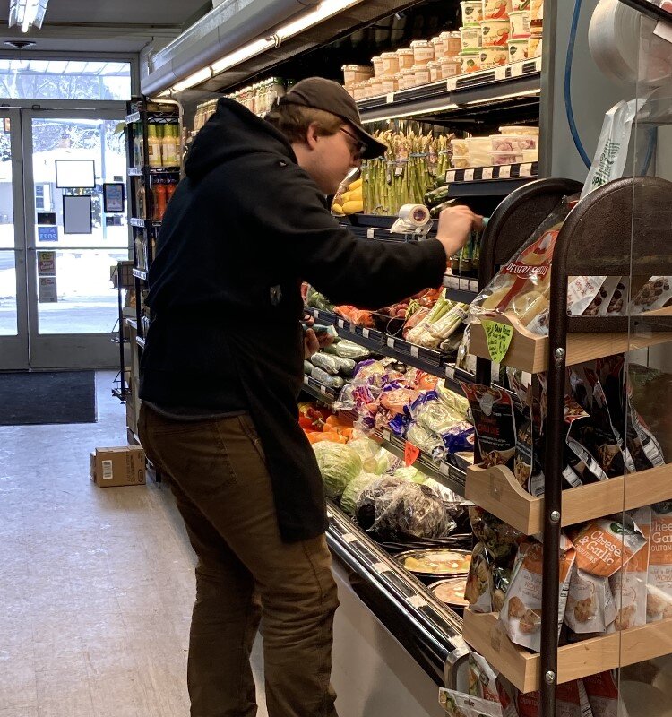 Stocking produce at LaLonde's.