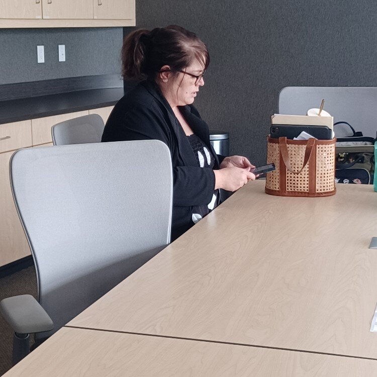 Kepler checks her phone before a meeting at the Midland Area Community Foundation.