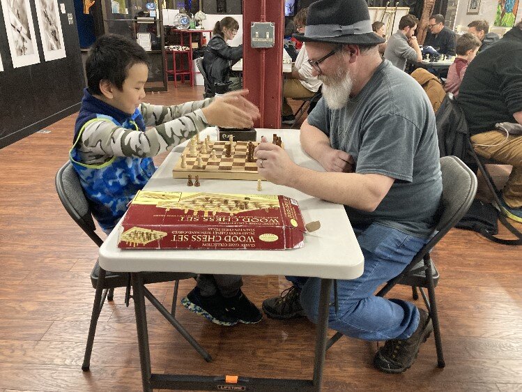 Dexter Brigham and one of the younger participants in the Midland Chess Club.