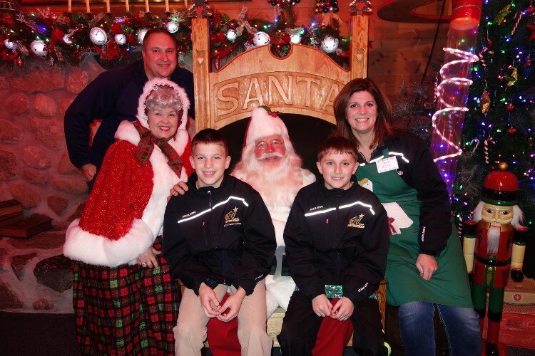 Family photo with Santa & Mrs. Claus a few years ago
