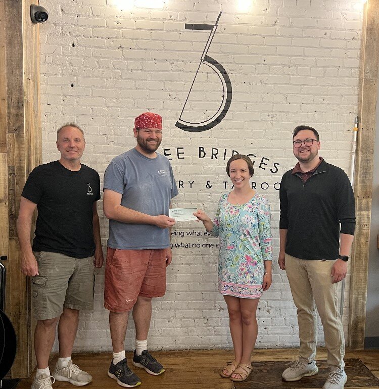 MYPros check presentation to 3 Bridges Distillery