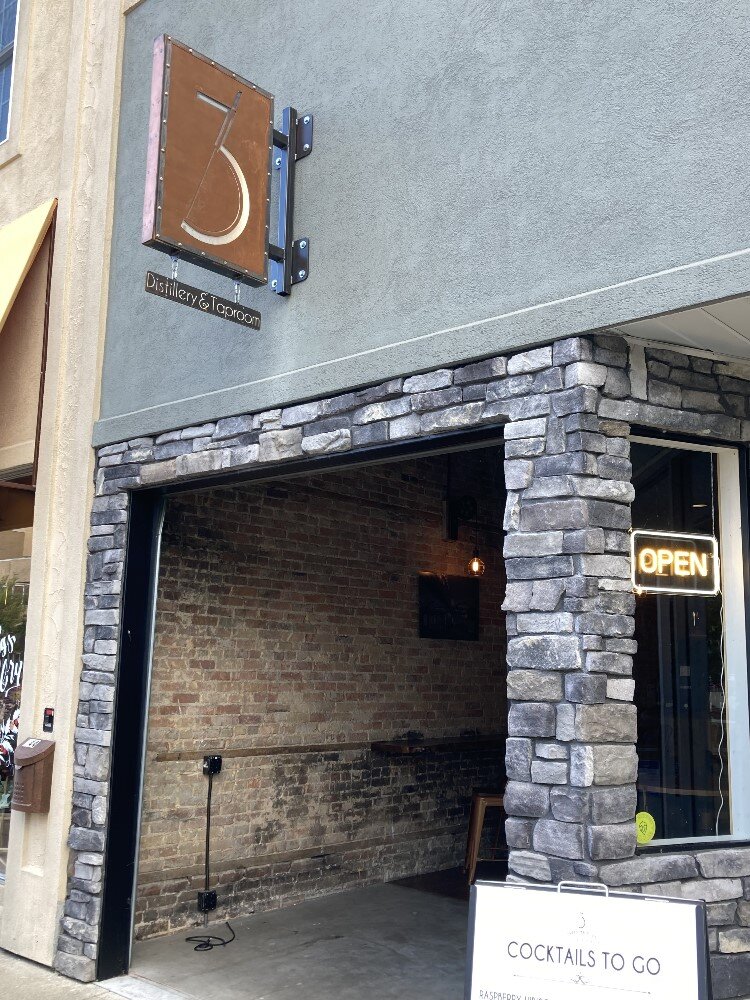  Three Bridges Distillery opens up into the sidewalk seating area.