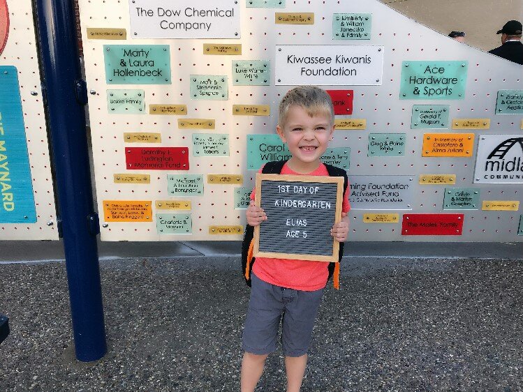 Posing for a first day of school picture.