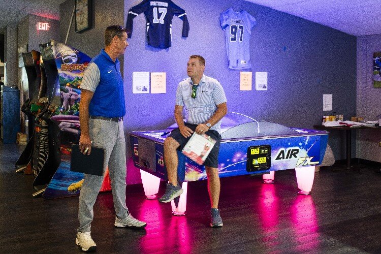 Frick's Sports Bar Co-owners Jeff Rekeweg, and Kurt Busard, chat about restaurant business during their weekly meeting.