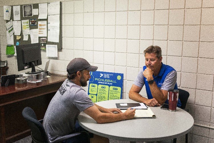 Jeff Rekeweg discusses ideas for a future youth program with Director of Junior Tennis Jared Flick.