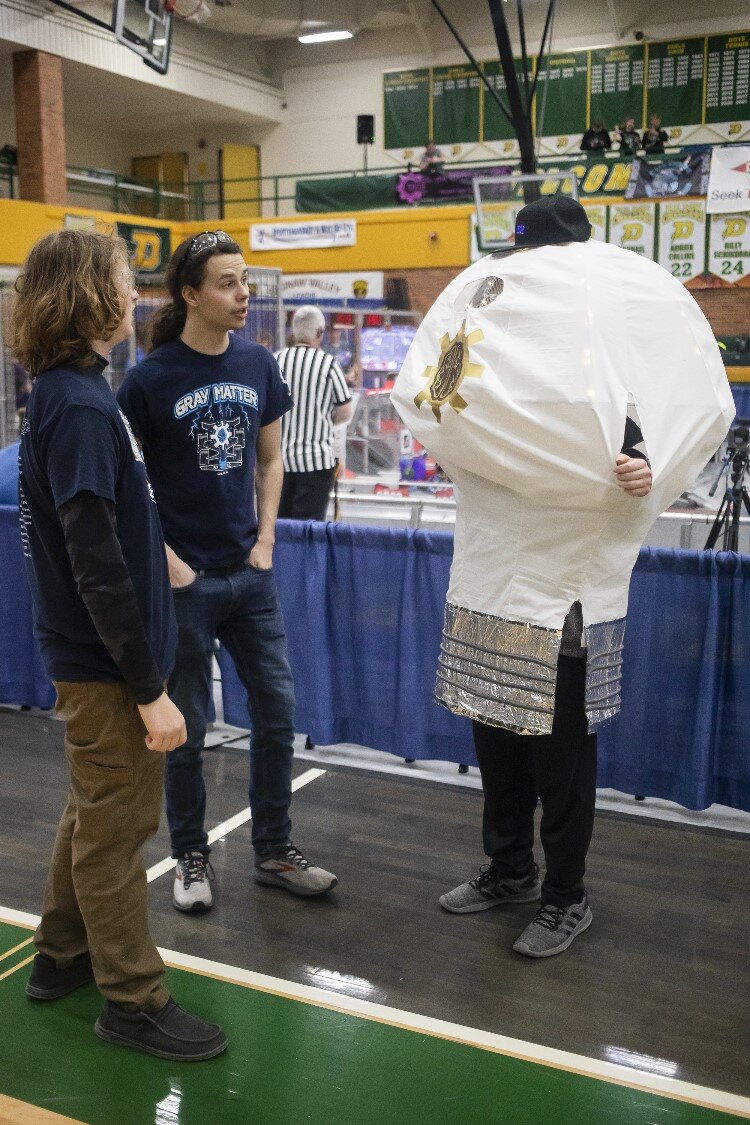 A student wears a mascot costume during the FIRST.