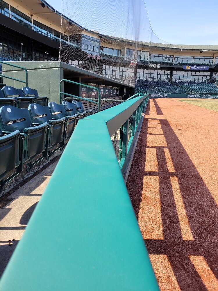 Railing along the 1st baseline at Dow Diamond