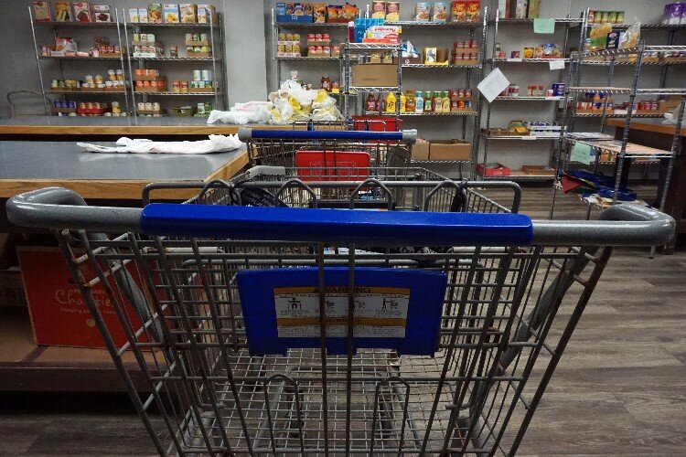 Clients of the pantry are welcome to fill a shopping cart with items of their choosing.