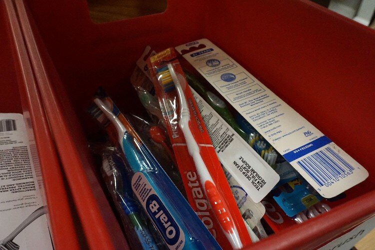 Hygiene items such as paper towels, laundry detergent, toothbrushes, deodorant, shampoo, and maxi pads are available in the pantries.