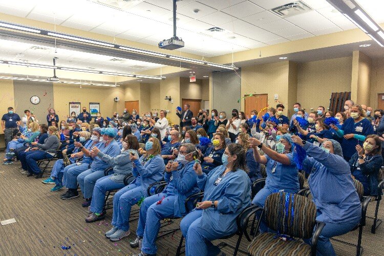 Staff gathering to celebrate to celebrate the Magnet recognition.