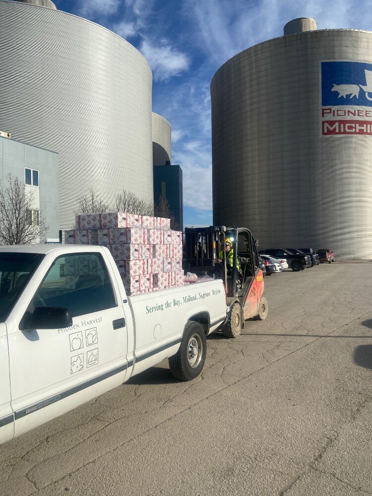 Hidden Harvest picking up a donation of frozen turkeys from Michigan Sugar.