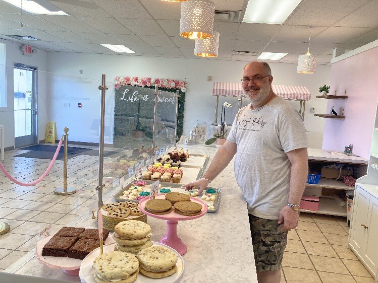 Dean Bard displays some of the pastries available at Enjoy Bakery, 144 Ashman Circle.