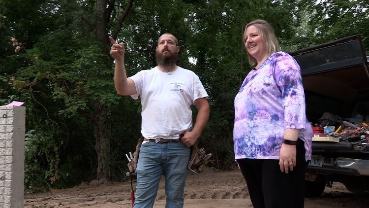Case manager Anne Wortley works with a homeowner on MIdland's west side in 2021.