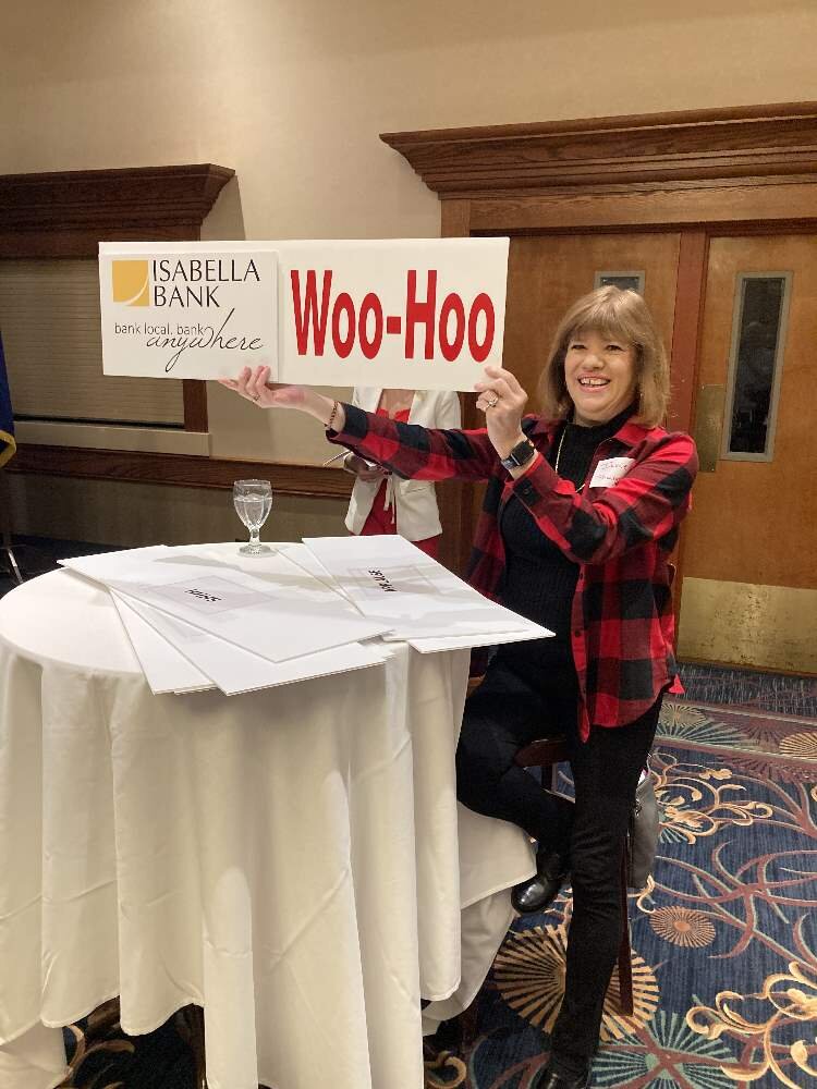 Member Jane Johnson elicits comments with one of her several cue cards.