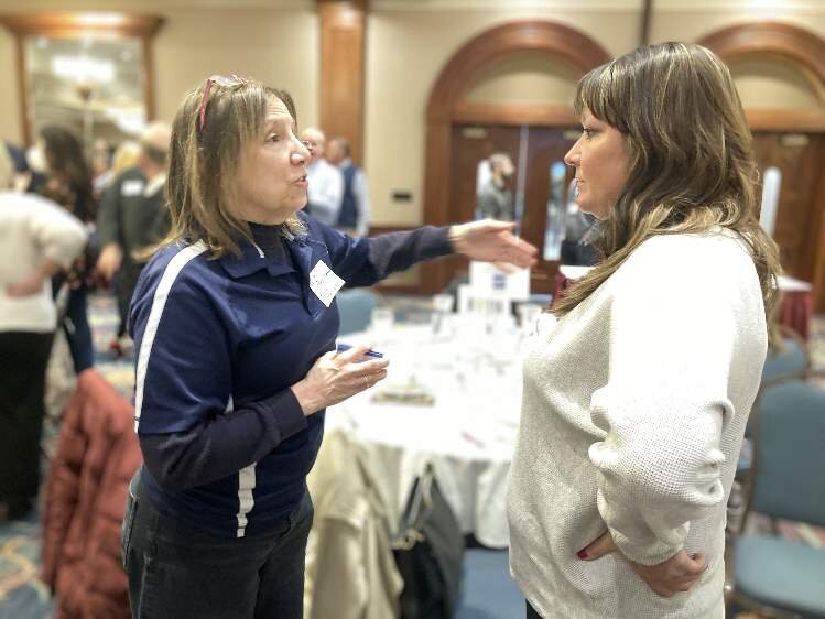 Robin Hamann and Heather Watson chat during the networking segment of WakeUp! Midland Friday. 