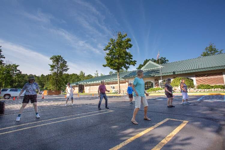 Line dancing class held outside during COVID-19 surge.