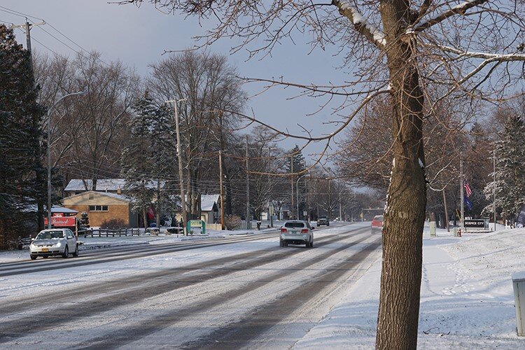 Bay City Road transitions from an industrial area into residential neighborhoods.