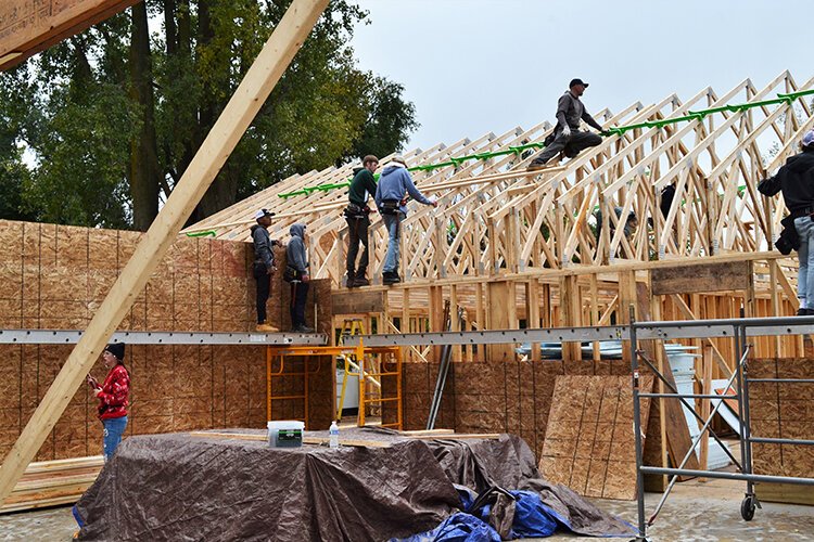 Students take part in every step of house construction.