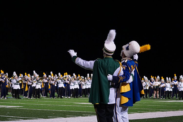 Despite being rivals, H.H. Dow and Midland High's bands have a lot of fun together. (Crystal Gwizdala)
