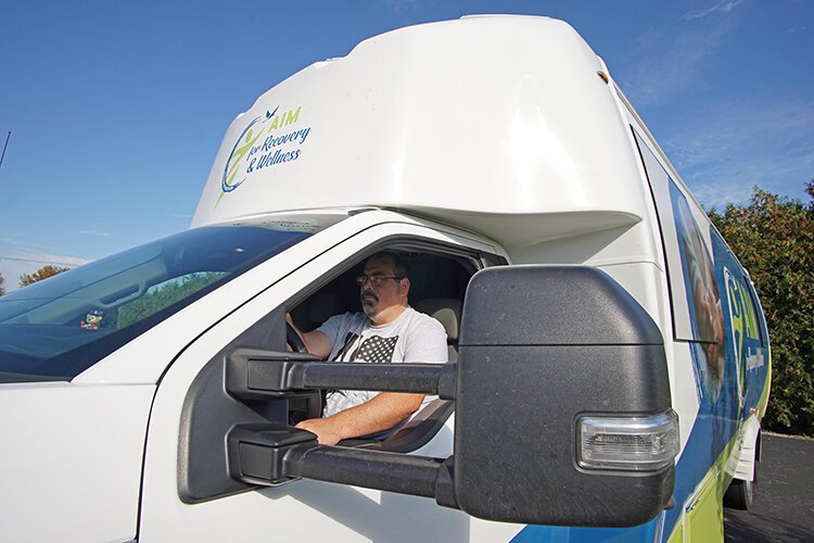 In addition to recovery coaching, Tommy Goodroe also drives the bus.