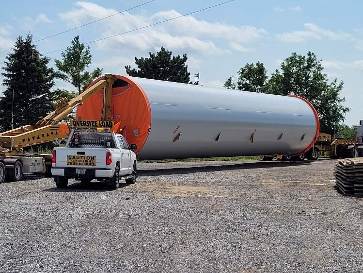 It's challenging to transport components of the wind turbines including the section of a tower.