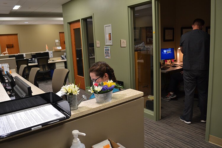 Provider and staff workstations are separated from exam rooms to foster focus and collaboration.