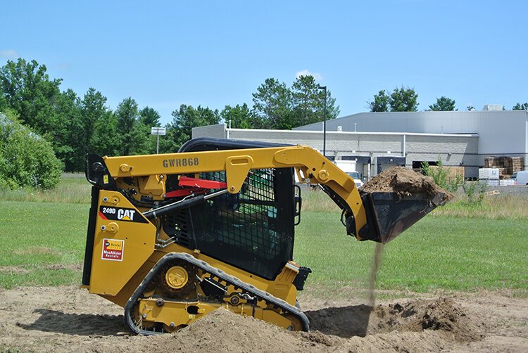 Students have the opportunity to use heavy machines.