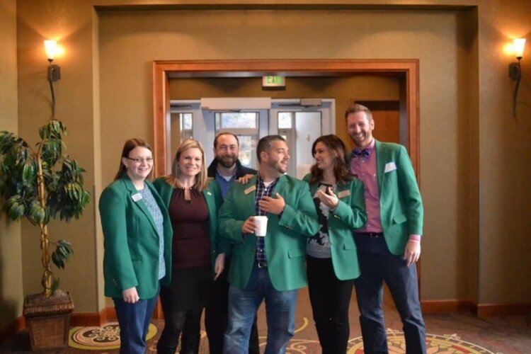 Michael Espinoza, holding the coffee cup, says many minorities don't realize they are welcome at chamber programs. To combat that perception, the Bay Area Chamber of Commerce recently formed a Minority Business Partnership.