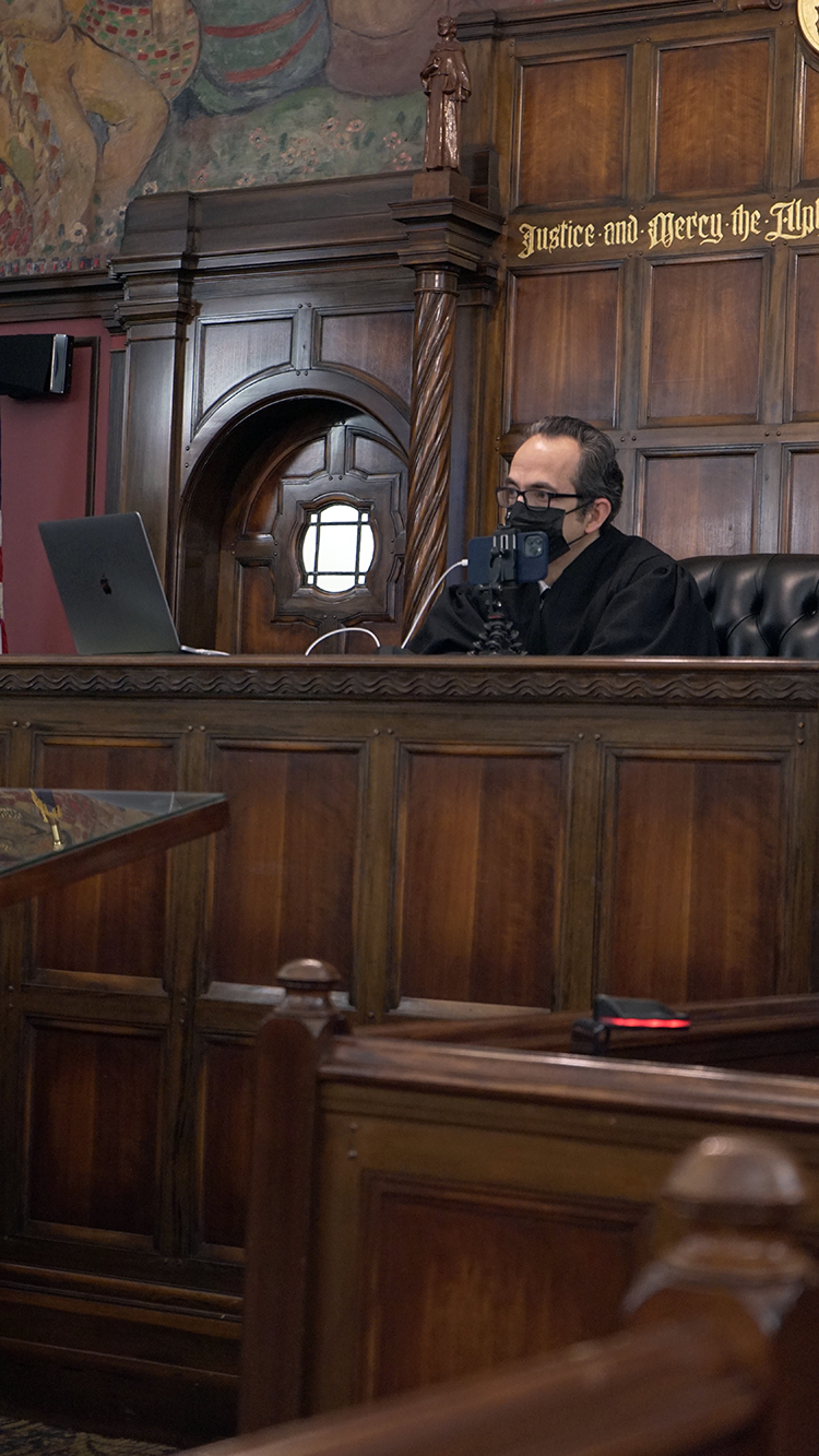 Chief Judge Carras asks questions of Wygant about his time in the MiHOPE program.