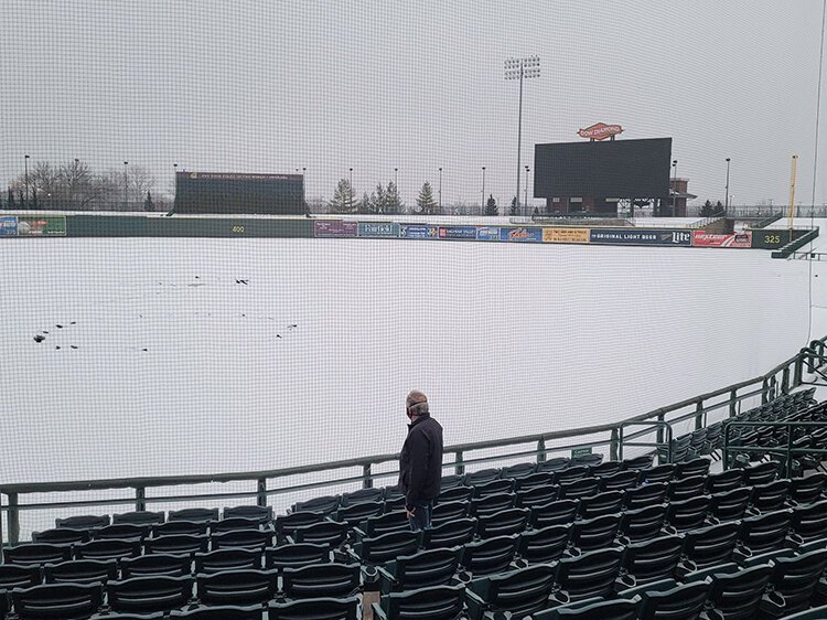 Hayes looks over the snow-covered field at Dow Diamond, about three months before the usual Opening Day.