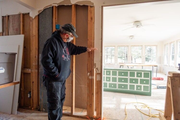 Hohmeyer shows how high the flood waters reached on the main level of this home.