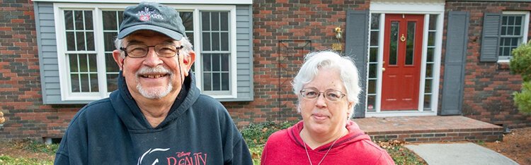 Jim Hohmeyer and Susan Mercy stand in front of the Valley Drive home, purchased from Tom Lane and Gail Hoffman.