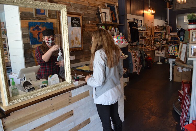 A shopper at Serendipity Road in downtown Midland.