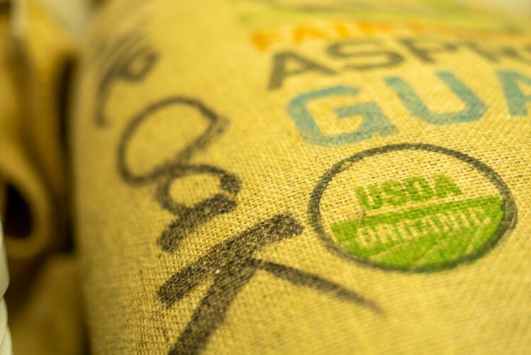 A bag of coffee beans that will soon be headed to a coffee cup near you.