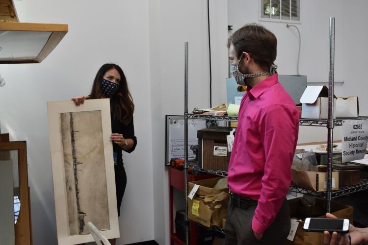 A graphite piece of Dow's plant that will be restored. A water line can be seen 2/3rds up.