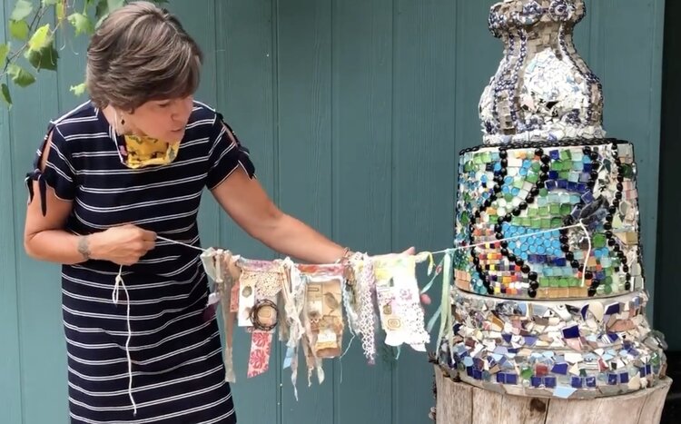 Dr. Laura Vosejpka with prayer flags.