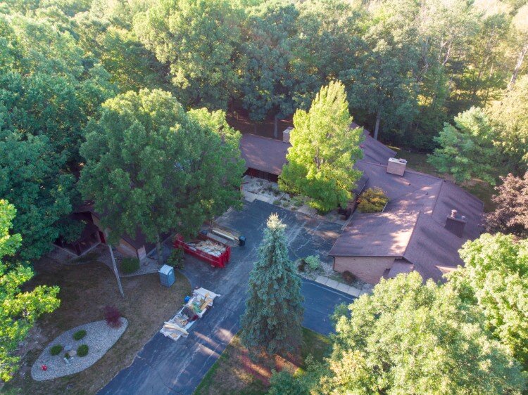 The 10-unit property is nestled in the woods by Northwood University in Midland.