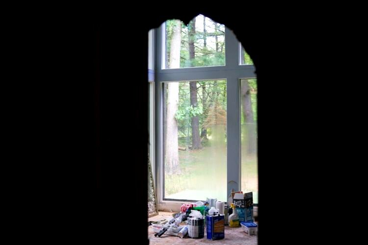 Looking into a neighboring unit from a hole in the wall.