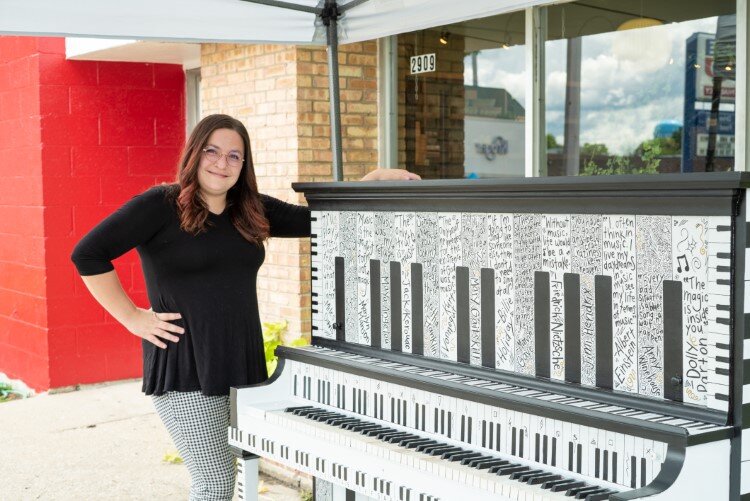Katy Kildee by her piano at Smith's Flowers.