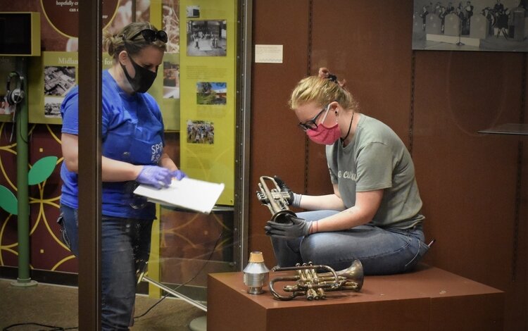 Volunteers help recovery and label instruments.